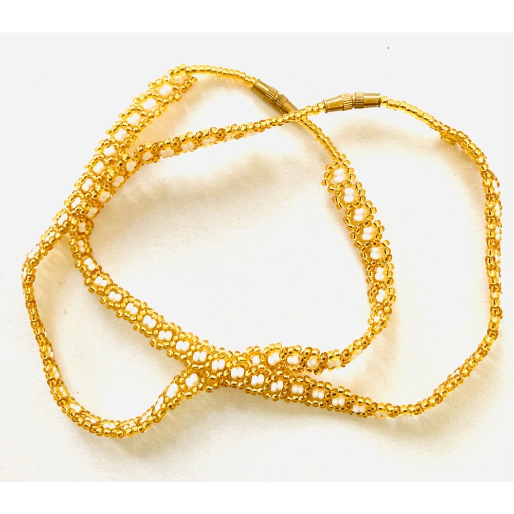 Pair of Beaded golden white anklets